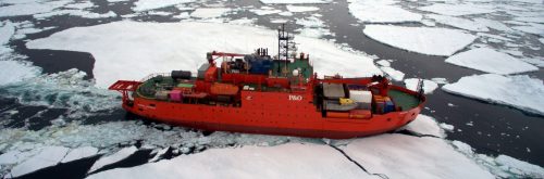 Ice Breaker in the ocean being surveyed by a drone.