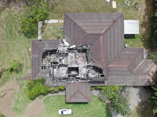 Inspection of house after fire damage.